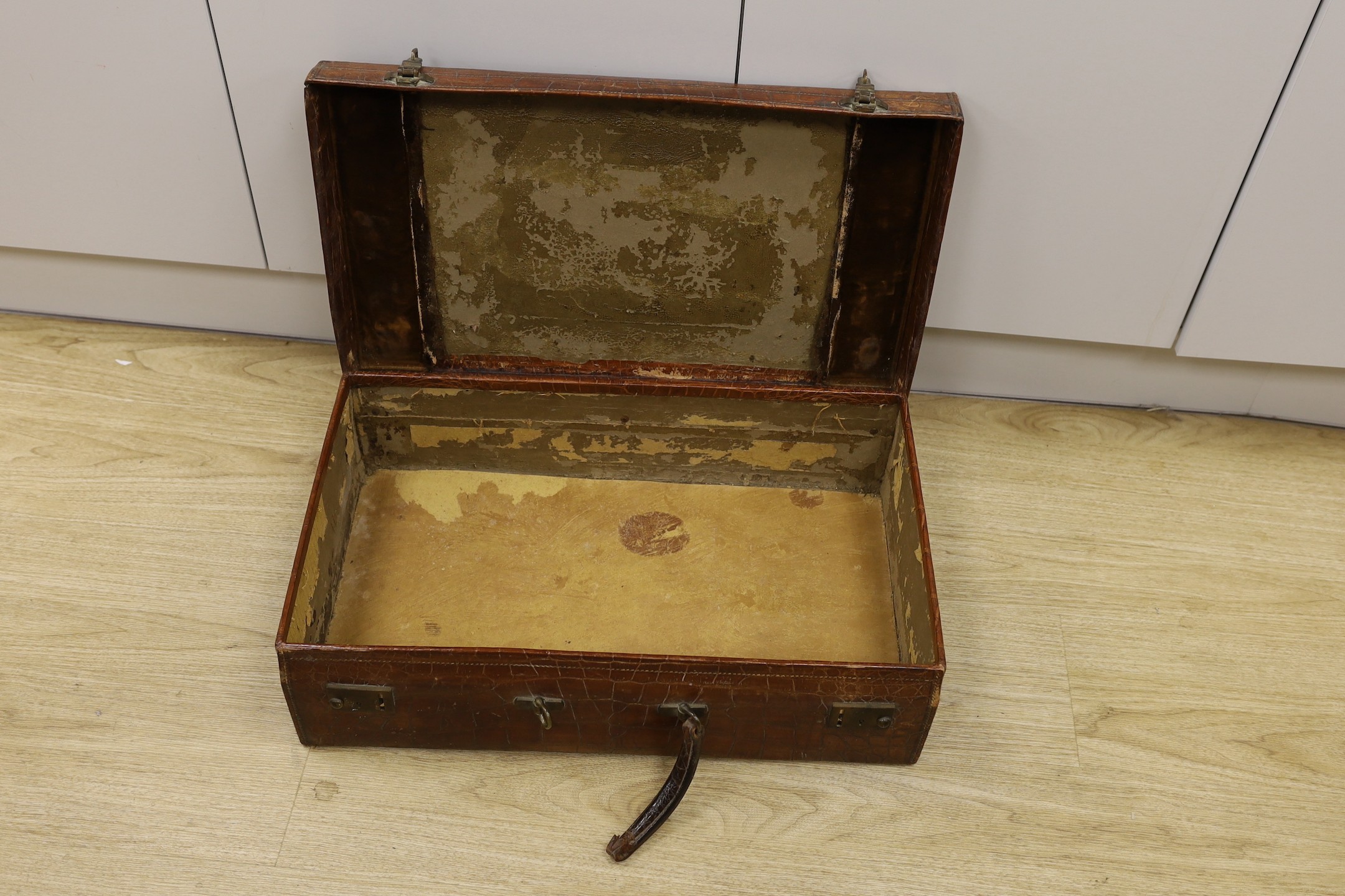 An early 20th Century crocodile skin suitcase - 60cm wide